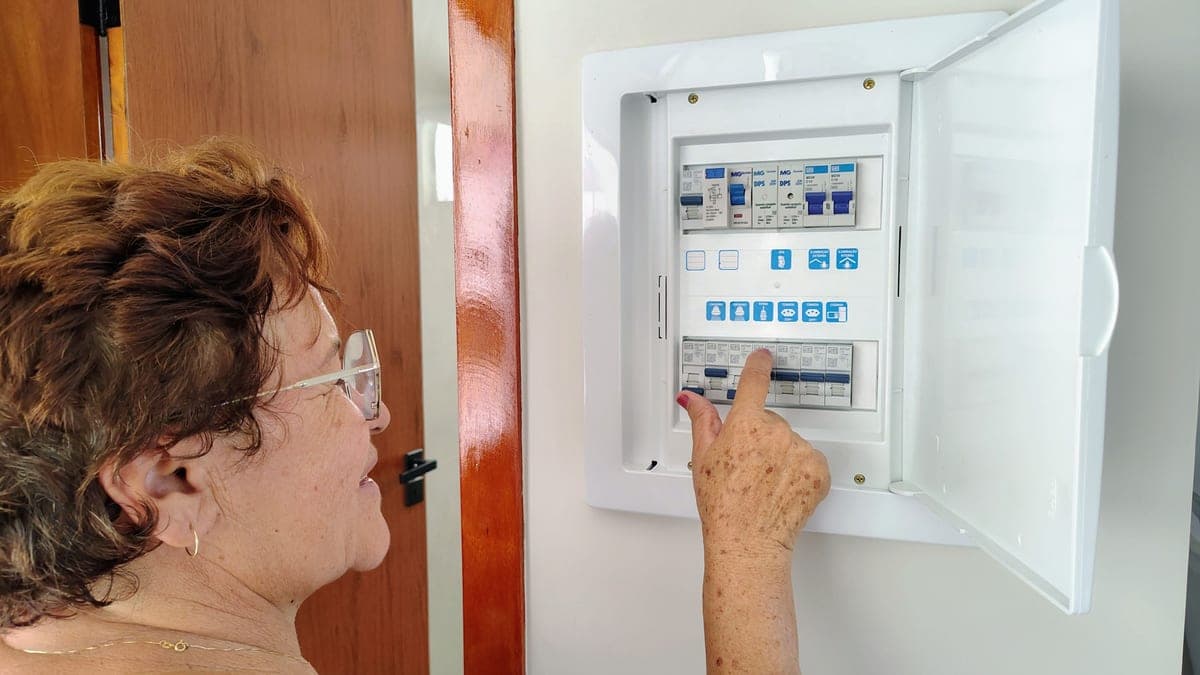 An open electrical panel with circuit breakers