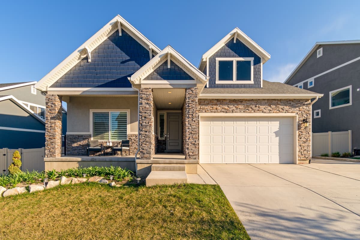 A two-story suburban house photographed in daylight