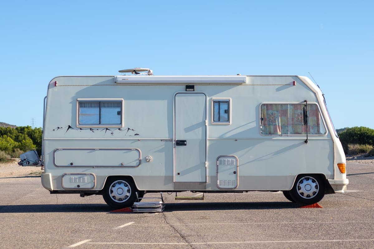A white camper van parked on a road